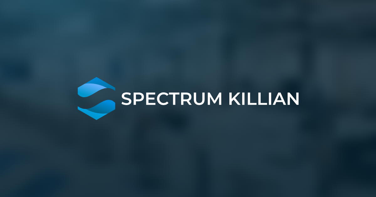The Spectrum Killian wordmark over a view of the production floor